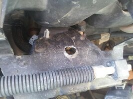Driver side ECM bracket hole.jpg